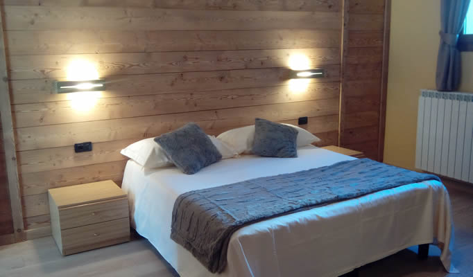 A typical bedroom in the Chalet Alpina