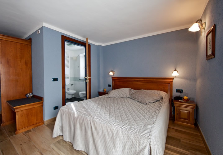 A typical bedroom in the Hotel Du Glacier, La Thuile